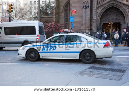 NEW YORK - APRIL 6: A New York City Police vehicle is parked outside of the Trinity Church in Lower Manhattan\'s Financial District in New York City; Photo taken on April 6, 2014.