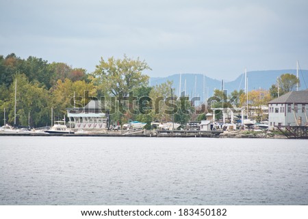 Shelburne, Vermont, USA - September 27, 2013: Sailboats are moored along the pier at the Shelburne Yacht Club on this sunny autumn afternoon.