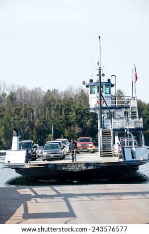 Charlotte, VT, USA - April 7, 2014: The ice breaker ferry prepares to land at the Charlotte ferry terminal on a late winter day.