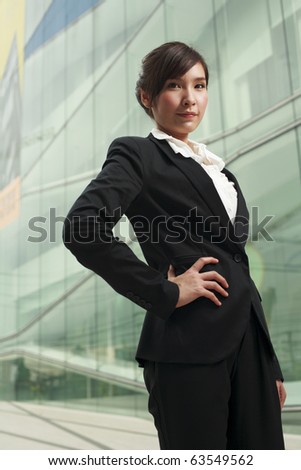 Portrait of a young asian confidential businesswoman standing alone