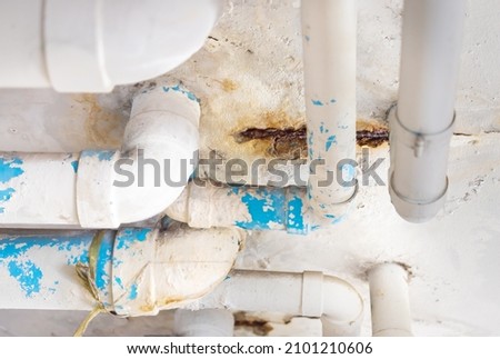 Damaged PVC Water pipe leak , building drainage pipes crack seep problem need to fix Stok fotoğraf © 
