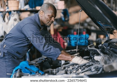 Similar – Image, Stock Photo Male mechanic checking car engine in service