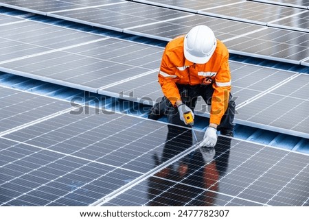 Similar – Image, Stock Photo Solar system on the roof with snow in winter. Remove snow from solar panels in winter. Remove snow photovoltaic system