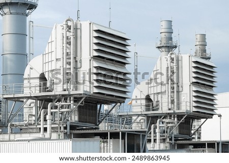 Similar – Image, Stock Photo Gas turbine electrical power plant. Energy for support factory. Natural gas tank. Chimney tower of gas power plant. Power plant using natural gas for fuel. Green energy. Power station against gray sky