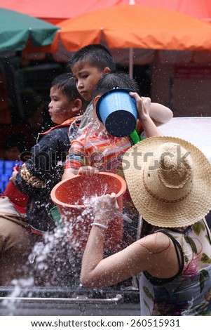LAMPANG, THAILAND - 13 APRIL 2011: In Songkran festival people will carry tank of water on thair truck drive around the city.