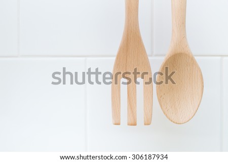 clean wood spoon and fork with composition space for text