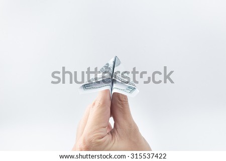 hand with money plane,freedom payment concept.