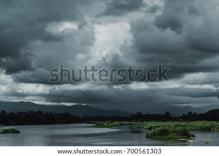 Similar – Image, Stock Photo Cloudy sky and mountain reflected in lake