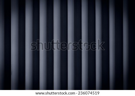 Dark rolling shutter door texture vertical lines
