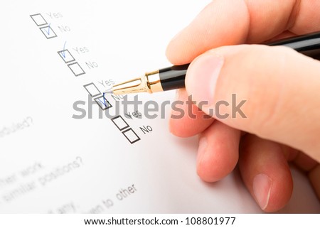 Filling of questionnaire a person by a ball point pen