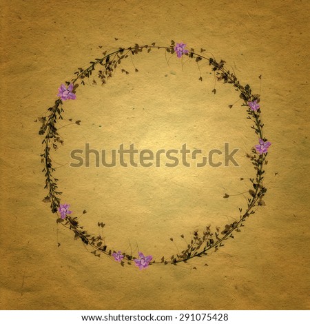 Floral Round Frame with small purple flowers and sepia background.