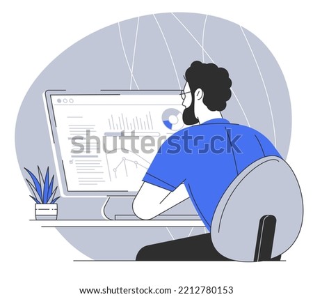 Attractive young confident man sitting at the office table.