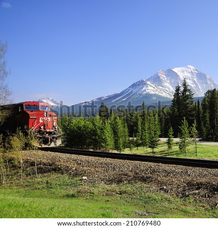 LAKE LOUISE STATION, CANADA - JUNE 09: Long freight train goes from Calgary to Vancouver and approach to the station on June 09, 2011 in Lake Louise, Canada.