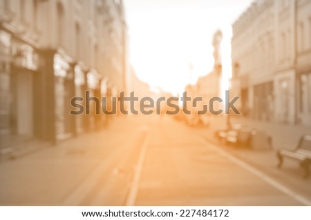 beautiful street in the historical city center at sunrise time. Blurred vintage image.