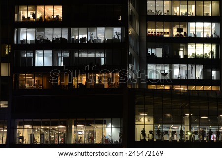 MOSCOW, RUSSIA - JANUARY 16, 2015:  Windows of the offices and the fitness center in the skyscraper in Moscow city district, Moscow, January 16, 2015.