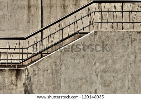 Gray concrete stairway with metal railing