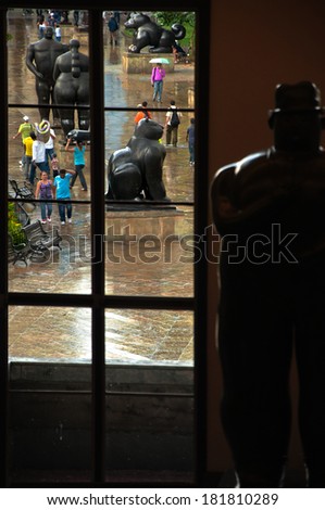 MEDELLIN, COLOMBIA - NOVEMBER 5: People pass through the Botero Plaza in Medellin, Colombia, which features sculptures by Fernando Botero on November 5, 2011.