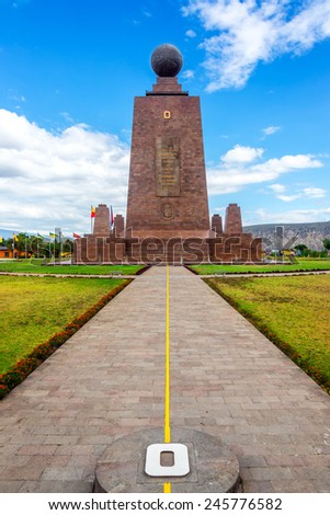 View of the Mitad del Mundo monument to the equator near Quito, Ecuador.  The yellow line divides the southern and northern hemispheres