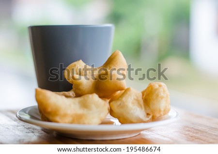 Coffee with fried bread stick, Thai style food.