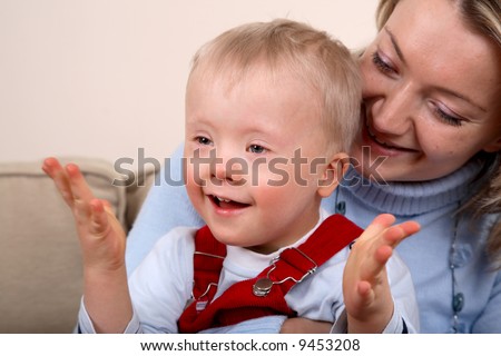 Young boy with Down Syndrome and his mother