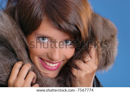 A beautiful girl with a fur collar