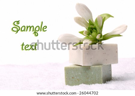 Soap Bars and white towels with flower isolated on pure white background. Bathroom composition.