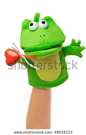 Hand puppet of frog with red heart isolated on white