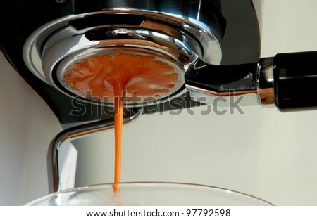 drops of fresh coffee converging into a single drop