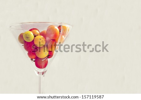Tomatoes in a glass vase. Still life with red tomatoes. Card for Thanksgiving