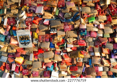 COLOGNE, GERMANY NOVEMBER 1ST 2014 -  To prove their love, couples fix padlocks to the railings of Hohenzollern Bridge in Cologne, to ensure it is everlasting they throw the key into the river below.