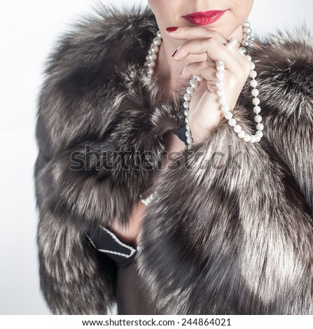 Beauty fashion model girl in fur coat.