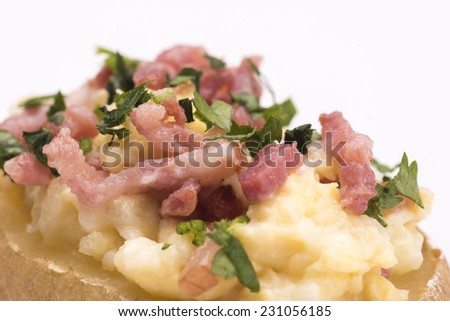 Sandwich with bacon and eggs against white background