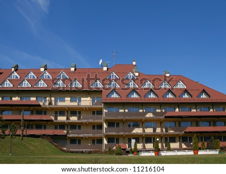 Expensive mountain resort hotel in Poland. Blue sky.