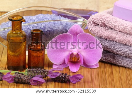 Spa relaxation composition - bath soap, towels, orchid flower, bottles with lotions