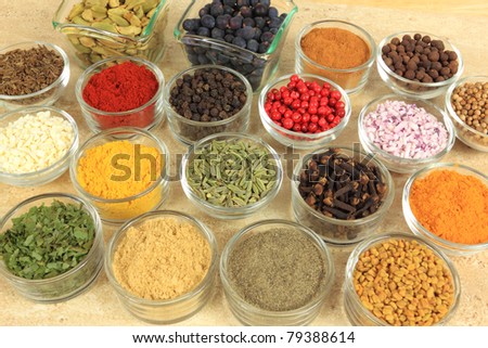 Cuisine ingredients - herbs and spices. Food additives in glass bowls.