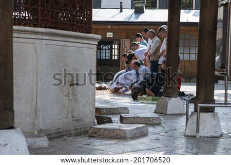 Friday prayer time/Bosniak muslim are taking the prayer after washing their feet in the Old Town Mosque. Sarajevo, Bosnia and Herzegovina, July 12, 2013