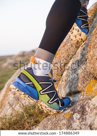 Extreme sports shoes for trail running practice in nature.