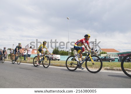 FERROL, SPAIN - SEPTEMBER 10: Unknown racers on the competition Tour of Spain (La Vuelta) on September 10, 2014 in Ferrol, Spain. The photo shows cyclists in a row