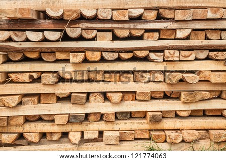 lumber cross stacked together in the lumber factory