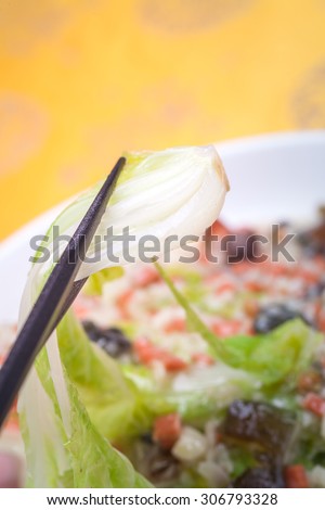 Steamed Chinese Cabbage in Supreme Soup with ham sausage and preserved egg grain soup