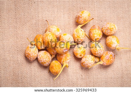 ginkgo fruits stacked together on flax cloth