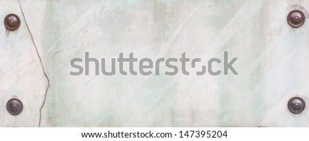 Ancient stone broken plate with marble surface which attached by four cooper nails with caps covered by patina with clipping path around caps