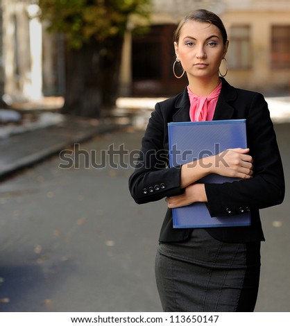 Portrait of Successful young business woman with brief case