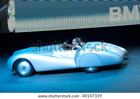 FRANKFURT - SEPTEMBER 20: Driving with an old timer at the BMW hall - Efficient Dynamics on 63rd IAA (Internationale Automobil Ausstellung) on September 20, 2009 in Frankfurt, Germany.
