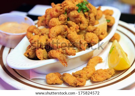 A delicious appetizer plate of New Orleans style Crawfish with dipping sauce and lemon