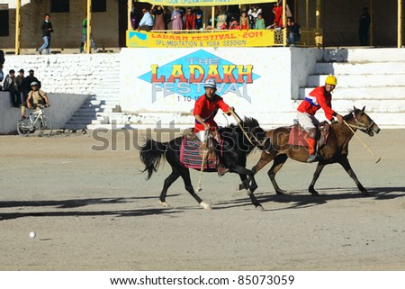 LEH,  LADAKH - SEPTEMBER 3: Unidentified  polo players charge after the ball at a match in Leh\'s polo grounds on September 3, 2011, in Leh, Ladakh.