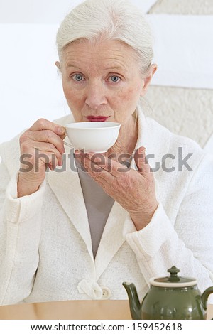 good looking senior having a cup of tea