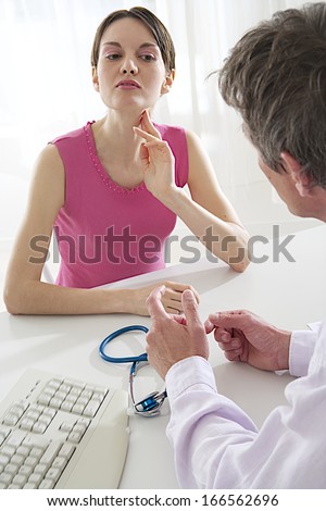 Young woman complains of a sore throat your doctor.