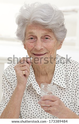 Elderly woman Taking Medication