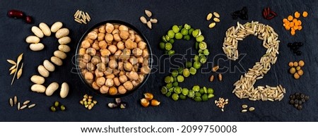 Voeux 2022 inscrit avec des legumes secs, des graines proteines vegetales Photo stock © 